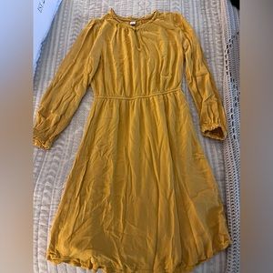 Yellow, short dress, long sleeve, key hole neck in front.